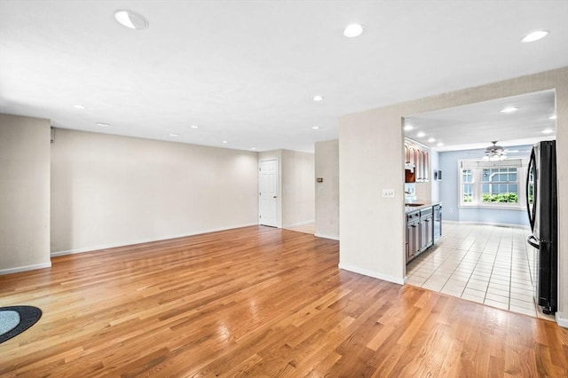 10 Freedom Holw Unit 10, Salem, MA 01970 - unfurnished living room with light wood finished floors, recessed lighting, and ceiling fan