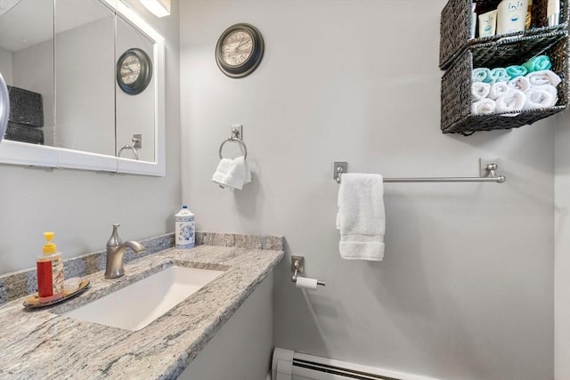 bathroom featuring a sink and a baseboard radiator