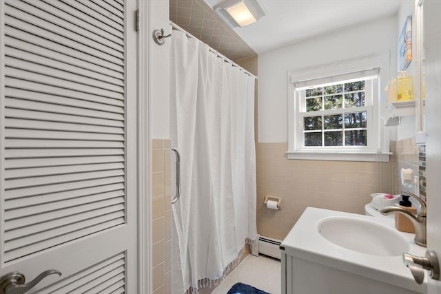 bathroom featuring vanity, tile walls, tile patterned flooring, and a shower with curtain