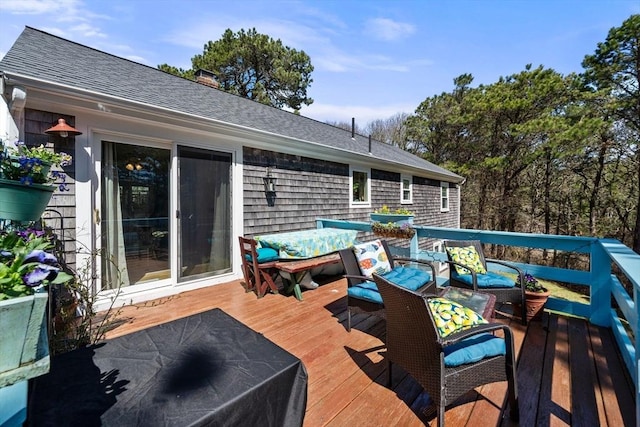 wooden terrace featuring outdoor lounge area