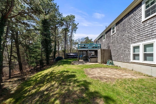 view of yard with a patio area, a jacuzzi, and fence