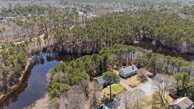 drone / aerial view featuring a water view and a view of trees