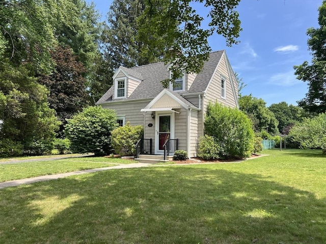 65 Franklin Rd, Longmeadow, MA 01106 - new england style home with a front yard and roof with shingles