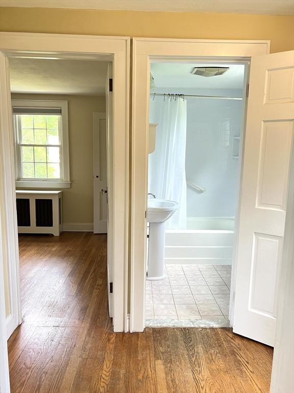 65 Franklin Rd, Longmeadow, MA 01106 - bathroom with wood finished floors and shower / bath combo with shower curtain