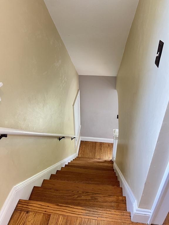 65 Franklin Rd, Longmeadow, MA 01106 - stairway featuring wood finished floors and baseboards