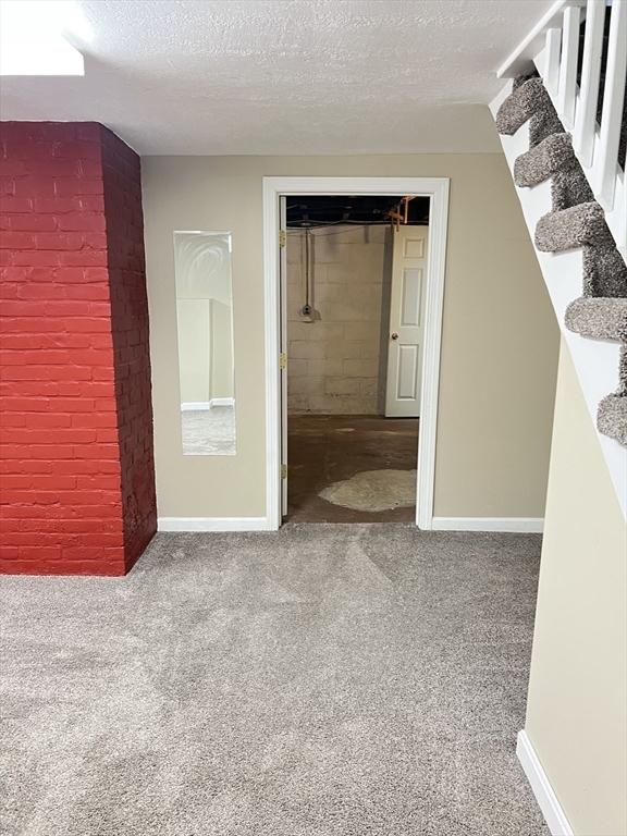 65 Franklin Rd, Longmeadow, MA 01106 - corridor with carpet flooring, a textured ceiling, and stairway