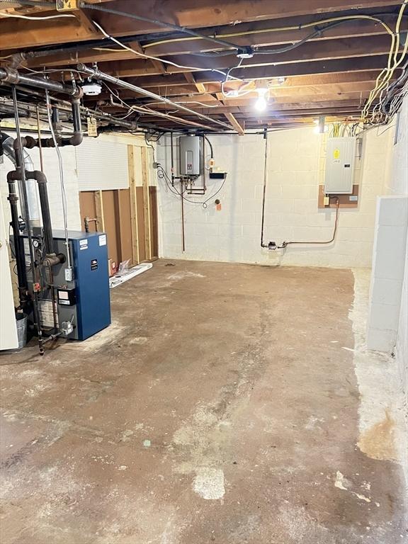 65 Franklin Rd, Longmeadow, MA 01106 - unfinished basement with electric panel, a heating unit, and water heater