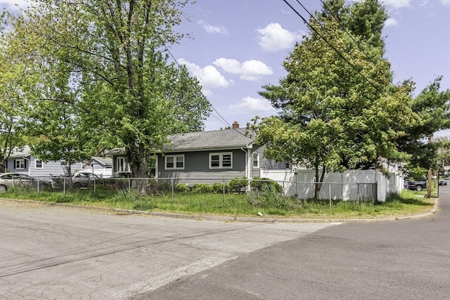 17 Barnard Rd, Lawrence, MA 01843 - view of property hidden behind natural elements with a chimney