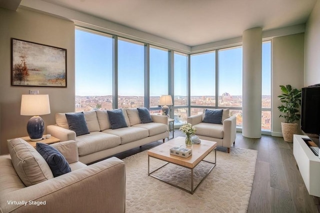 188 Brookline Ave Unit 23C, Boston, MA 02215 - living area with dark wood-style flooring and expansive windows