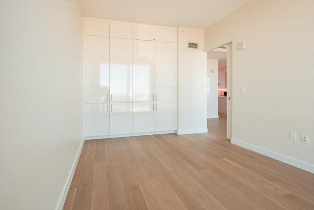 188 Brookline Ave Unit 23C, Boston, MA 02215 - unfurnished bedroom with light wood-style floors and a closet