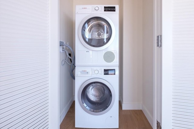 188 Brookline Ave Unit 23C, Boston, MA 02215 - washroom with stacked washer / drying machine and wood finished floors