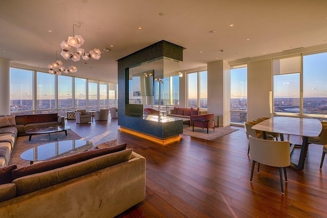 188 Brookline Ave Unit 23C, Boston, MA 02215 - living room featuring expansive windows, wood-type flooring, a chandelier, and plenty of natural light