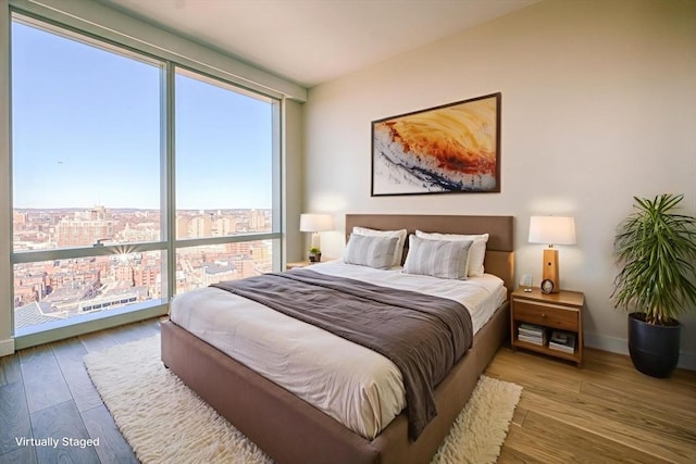 188 Brookline Ave Unit 23C, Boston, MA 02215 - bedroom featuring wood finished floors and a view of city