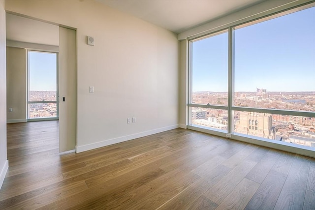 188 Brookline Ave Unit 23C, Boston, MA 02215 - empty room featuring wood finished floors and a city view