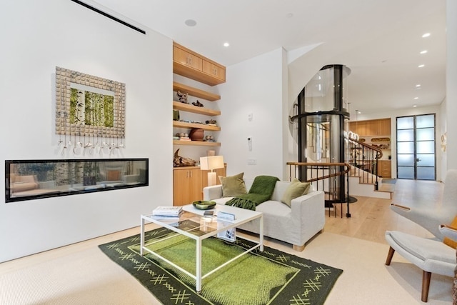 living room with light hardwood / wood-style flooring