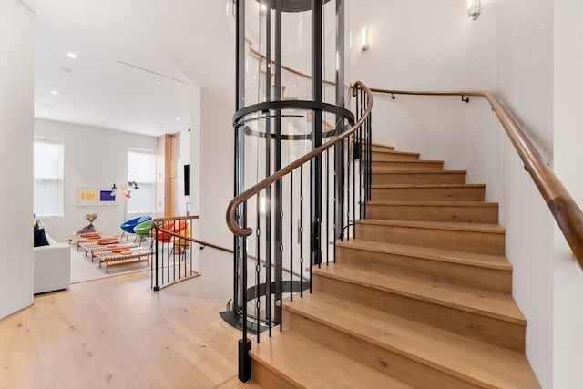 stairway with wood-type flooring