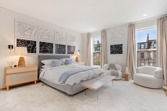 bedroom featuring light colored carpet