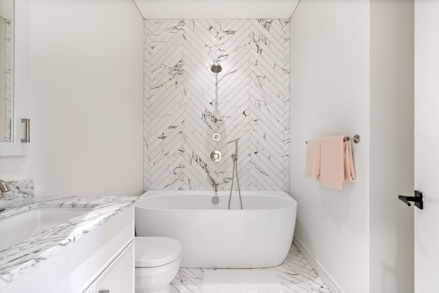 bathroom with tile patterned flooring, toilet, a washtub, and vanity