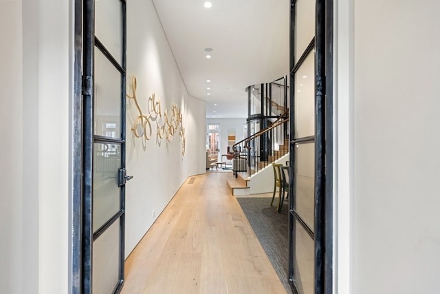 hall with light wood-type flooring