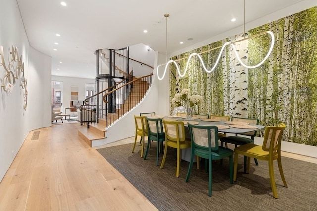 dining area with hardwood / wood-style flooring