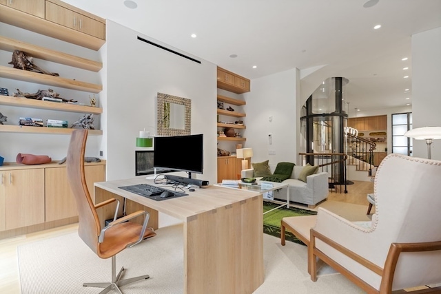 office area with light hardwood / wood-style flooring