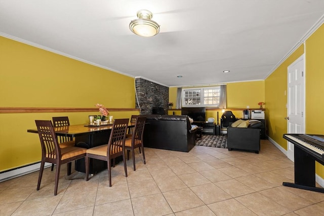 tiled dining area featuring ornamental molding