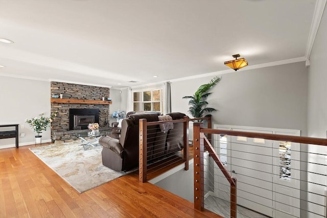 living room with crown molding and hardwood / wood-style flooring