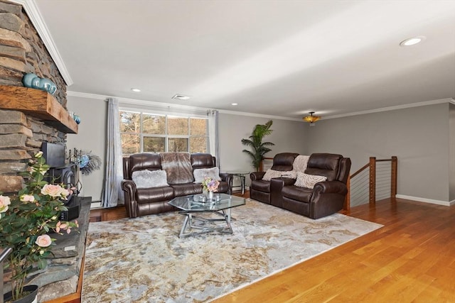 living room featuring hardwood / wood-style floors and ornamental molding