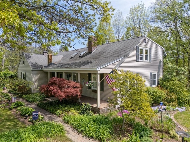 77 Center St, Ashburnham, MA 01430 - view of front of property with a chimney, roof with shingles, and covered porch