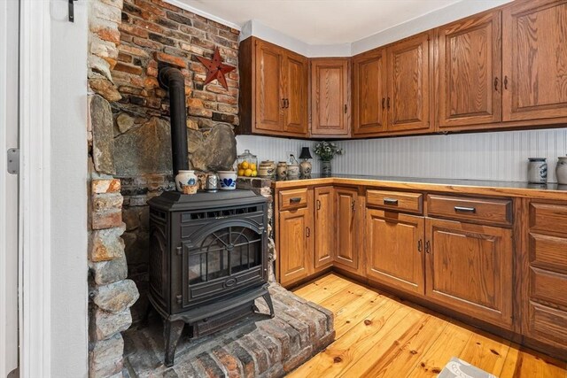 77 Center St, Ashburnham, MA 01430 - bar area featuring a wood stove and light wood-style flooring