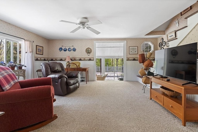 77 Center St, Ashburnham, MA 01430 - carpeted living area featuring wallpapered walls, wainscoting, plenty of natural light, and ceiling fan