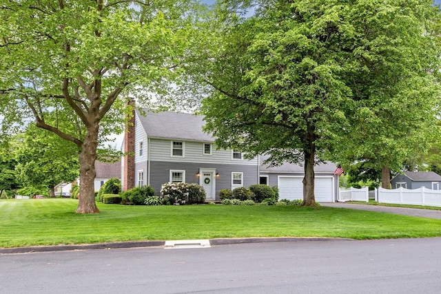 2 Ridge Rd, East Longmeadow, MA 01028 - colonial-style house with driveway, a chimney, and an attached garage