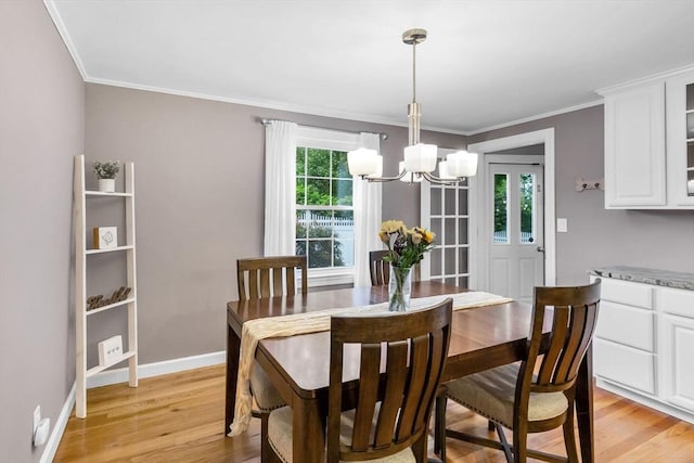 2 Ridge Rd, East Longmeadow, MA 01028 - dining space featuring a chandelier, light wood finished floors, baseboards, and crown molding