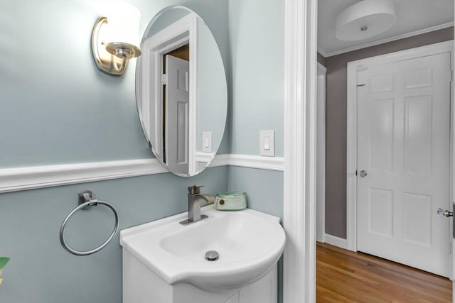 2 Ridge Rd, East Longmeadow, MA 01028 - bathroom featuring vanity, crown molding, and wood finished floors