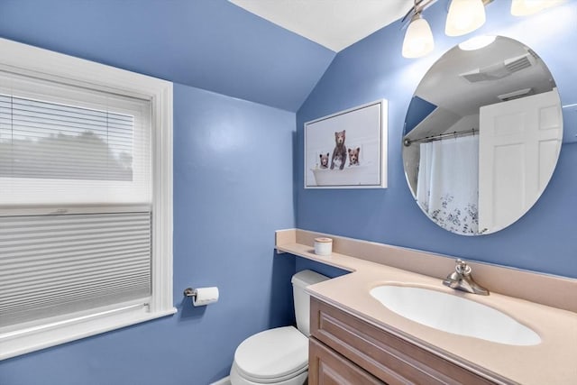 2 Ridge Rd, East Longmeadow, MA 01028 - bathroom featuring vanity, toilet, lofted ceiling, and a shower with curtain