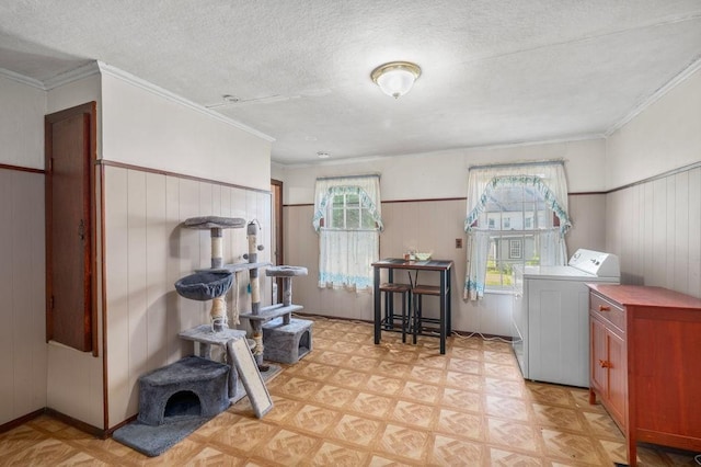 17-19 Whitehall Rd, Amesbury, MA 01913 - washroom featuring washer / dryer, a textured ceiling, light floors, wooden walls, and crown molding