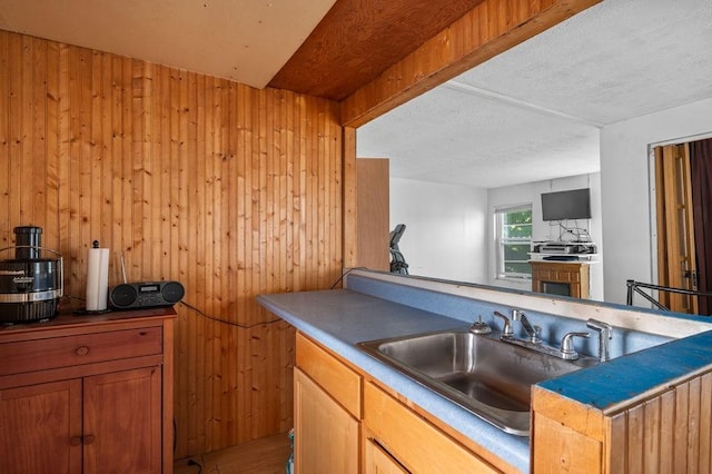 17-19 Whitehall Rd, Amesbury, MA 01913 - kitchen with wood walls, wood finished floors, open floor plan, and brown cabinets