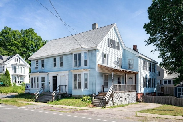 17-19 Whitehall Rd, Amesbury, MA 01913 - townhome / multi-family property featuring a chimney and a porch