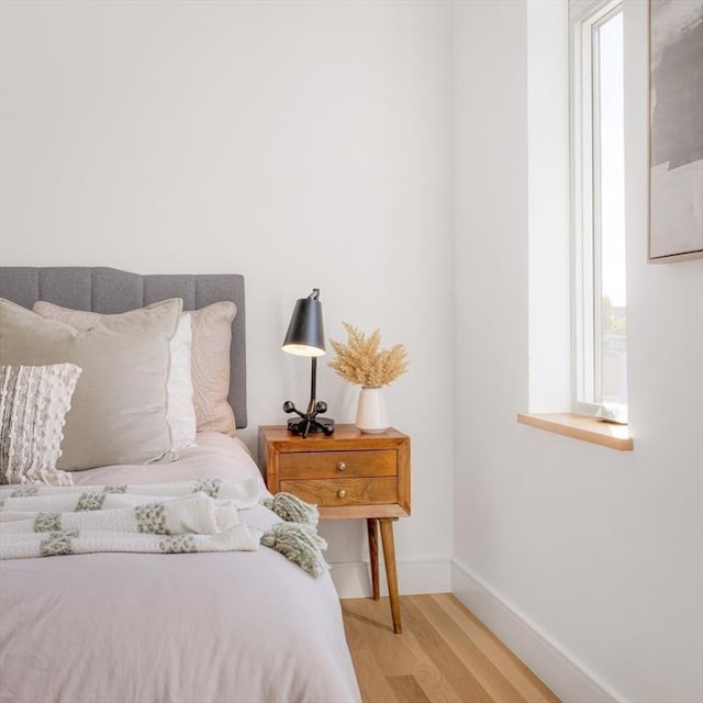 bedroom with light hardwood / wood-style flooring