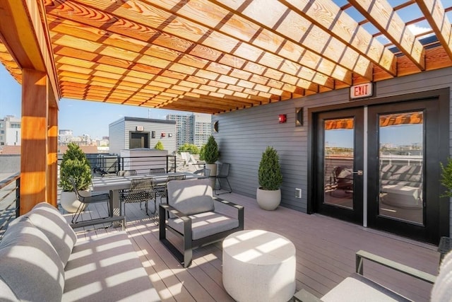 deck with an outdoor living space and a pergola