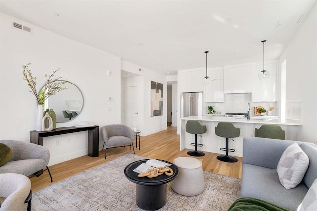 living room with light hardwood / wood-style floors