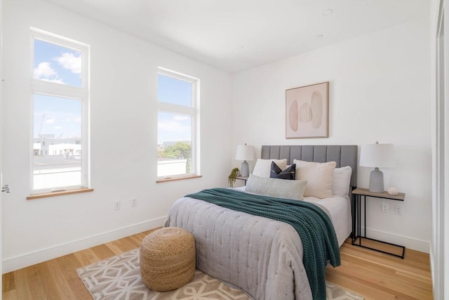 bedroom with light hardwood / wood-style flooring