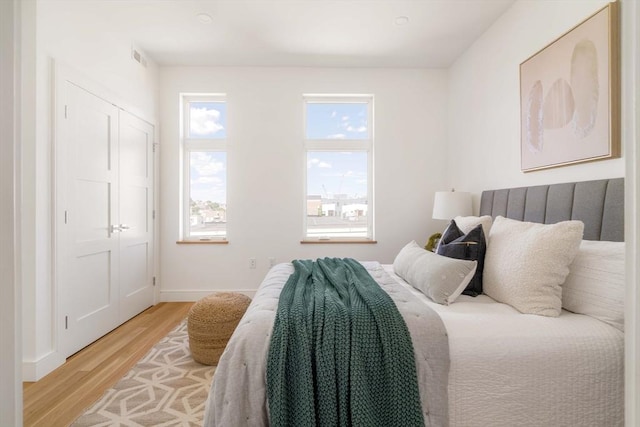 bedroom with light hardwood / wood-style flooring