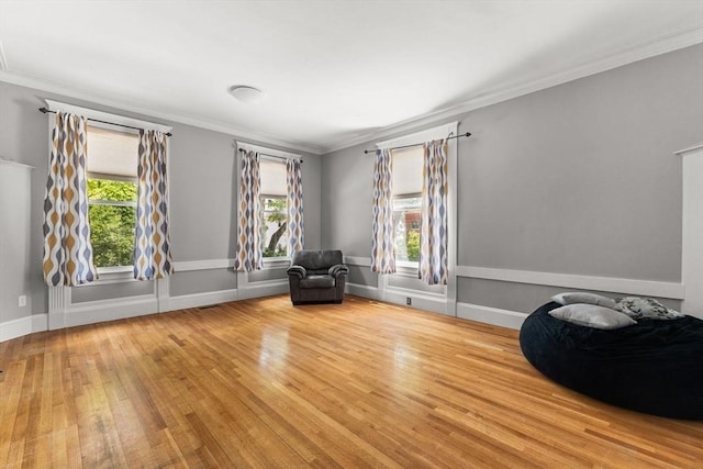 543 Newport Ave, Attleboro, MA 02703 - sitting room with wood finished floors, healthy amount of natural light, crown molding, and baseboards