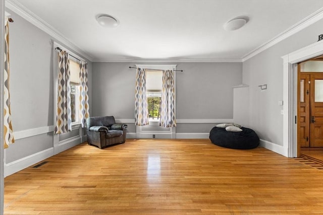 543 Newport Ave, Attleboro, MA 02703 - sitting room featuring crown molding, wood finished floors, and baseboards