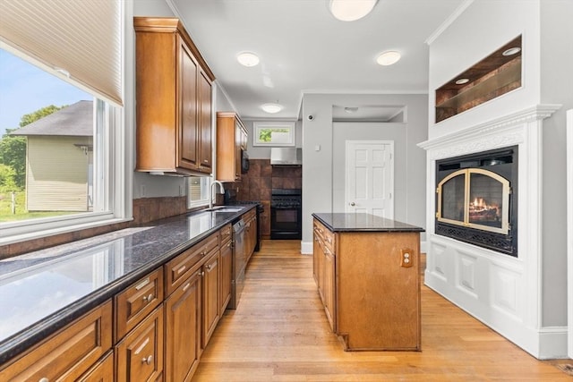 543 Newport Ave, Attleboro, MA 02703 - kitchen featuring a sink, range, a kitchen island, and light wood-style floors