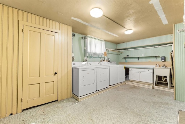543 Newport Ave, Attleboro, MA 02703 - laundry room with washing machine and dryer, cabinet space, and light colored carpet