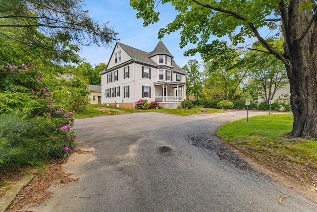 543 Newport Ave, Attleboro, MA 02703 - victorian-style house with covered porch and driveway