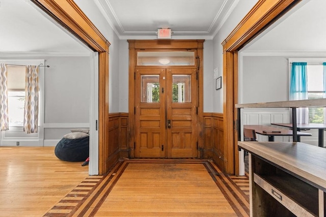 543 Newport Ave, Attleboro, MA 02703 - entryway with light wood-style floors, wainscoting, and ornamental molding