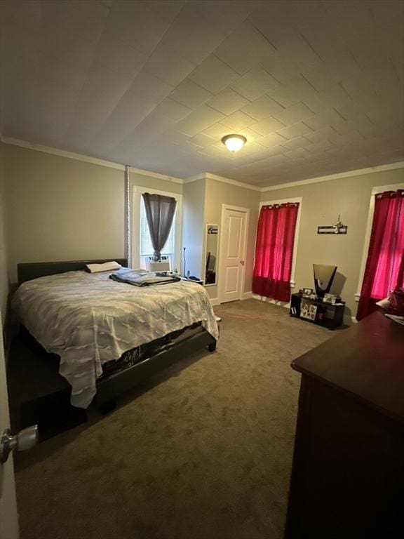 bedroom featuring carpet flooring and crown molding